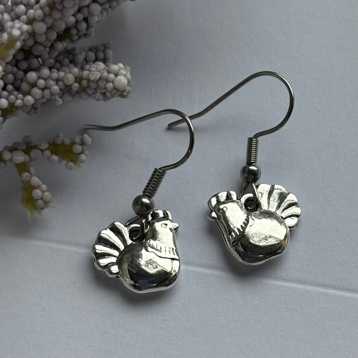Silver chicken earrings on hypoallergenic hooks