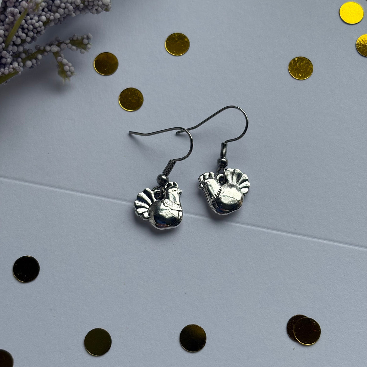 Silver chicken earrings on hypoallergenic hooks