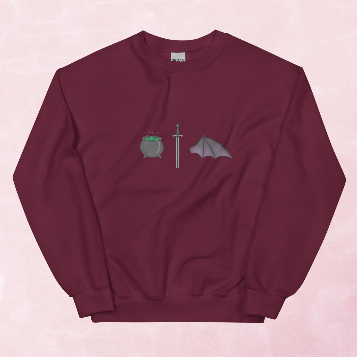 Cool hand illustrated cauldron sword and batwing fantasy book unisex graphic sweatshirt