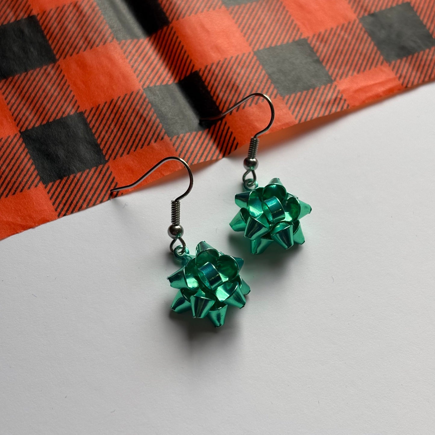 Colourful dangle Christmas fun quirky present bow earrings