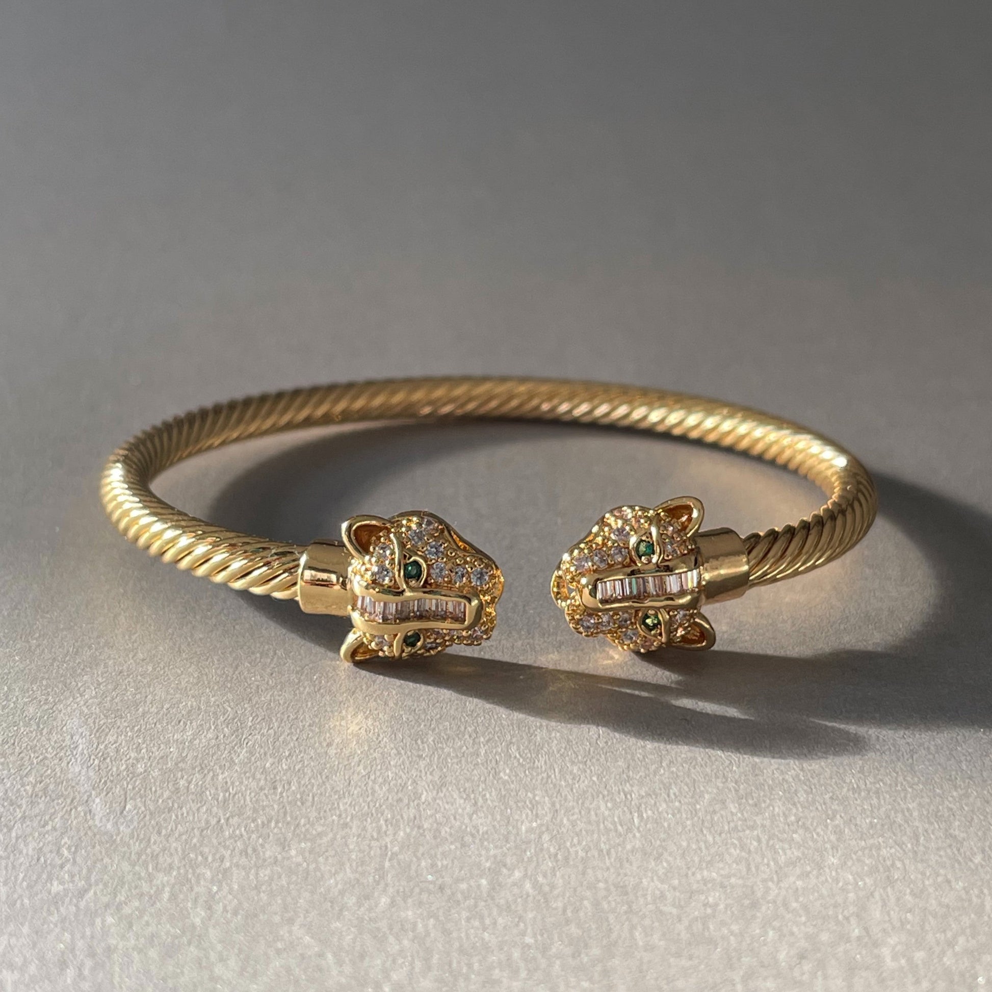 Zuri Gold Textured Panther Cuff bracelet with panther head design and twisted gold plating
