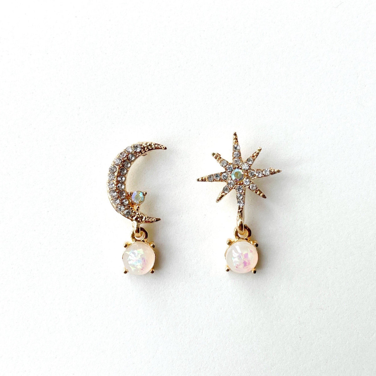 Andromeda Moon and Star stud earrings with crystal accents and opal-like drops in zinc alloy