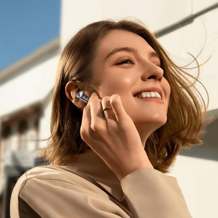 Samsung Galaxy Buds3 Pro wireless earbuds in metallic silver and black, worn in the ear with a sleek stem design