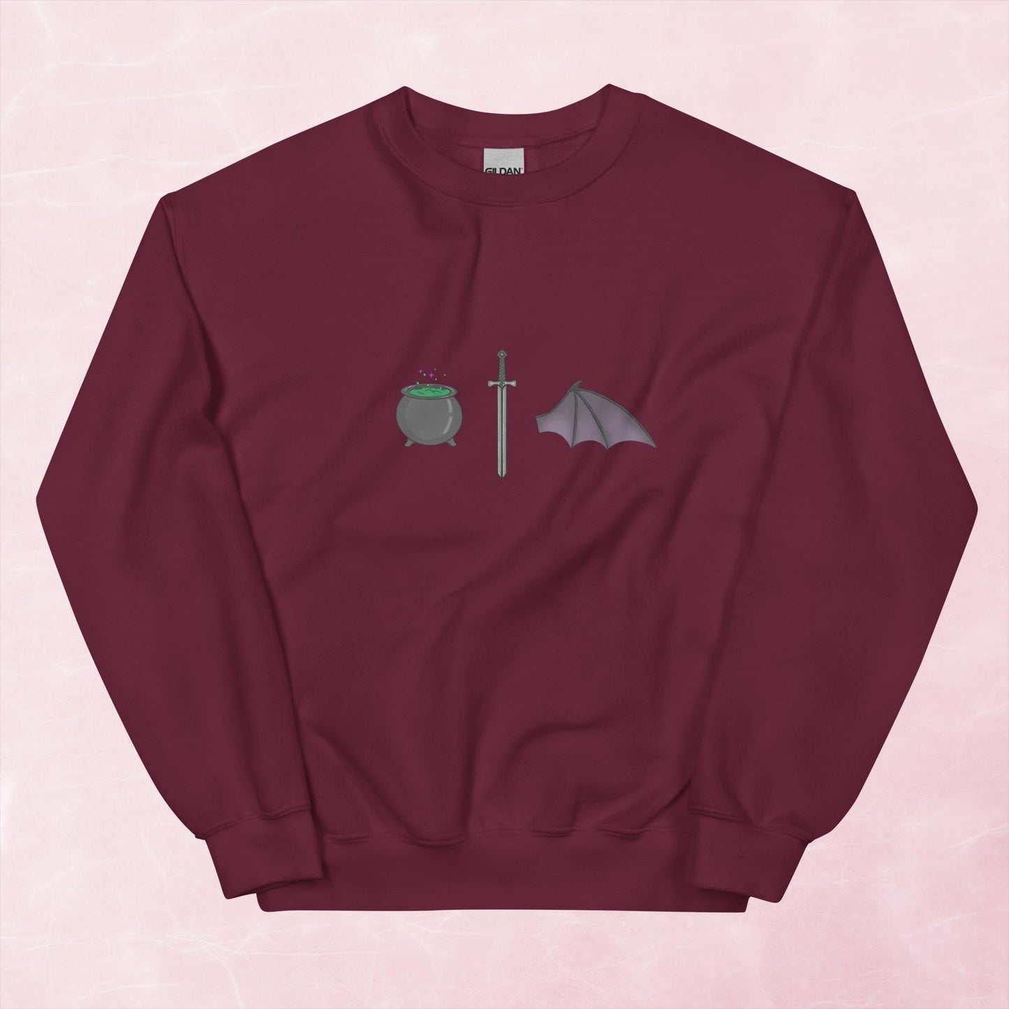 Cool hand illustrated cauldron sword and batwing fantasy book unisex graphic sweatshirt